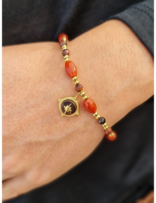 Bracelet élastique Carla en acier inoxydable couleur or avec perles orangées et pendentif